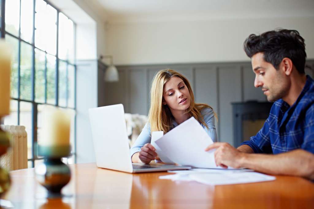 Couple reviewing financial documents